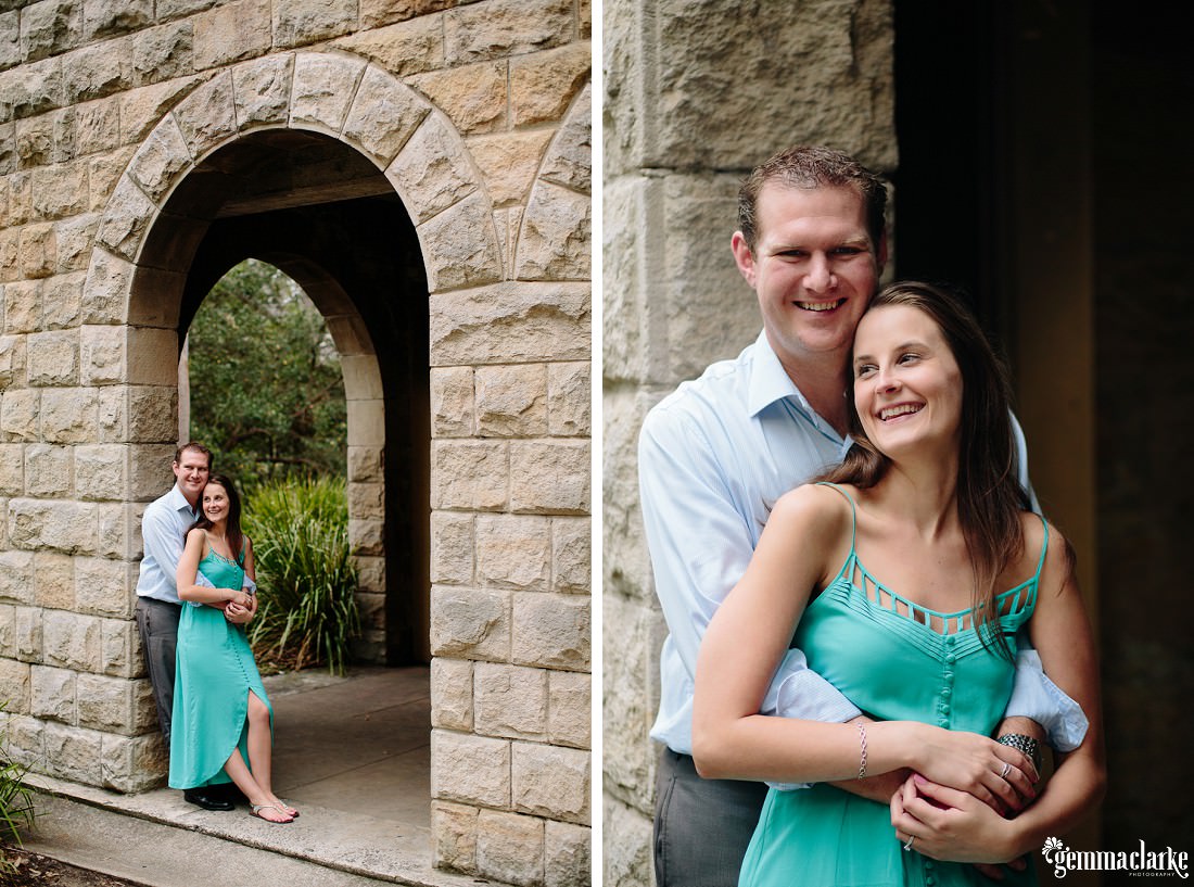 Two images of a couple - overall and showing a sandstone arch with the coupe embracing and leaning against the wall. The other image is a close up of them smiling against the wall - Oatley Park Portraits