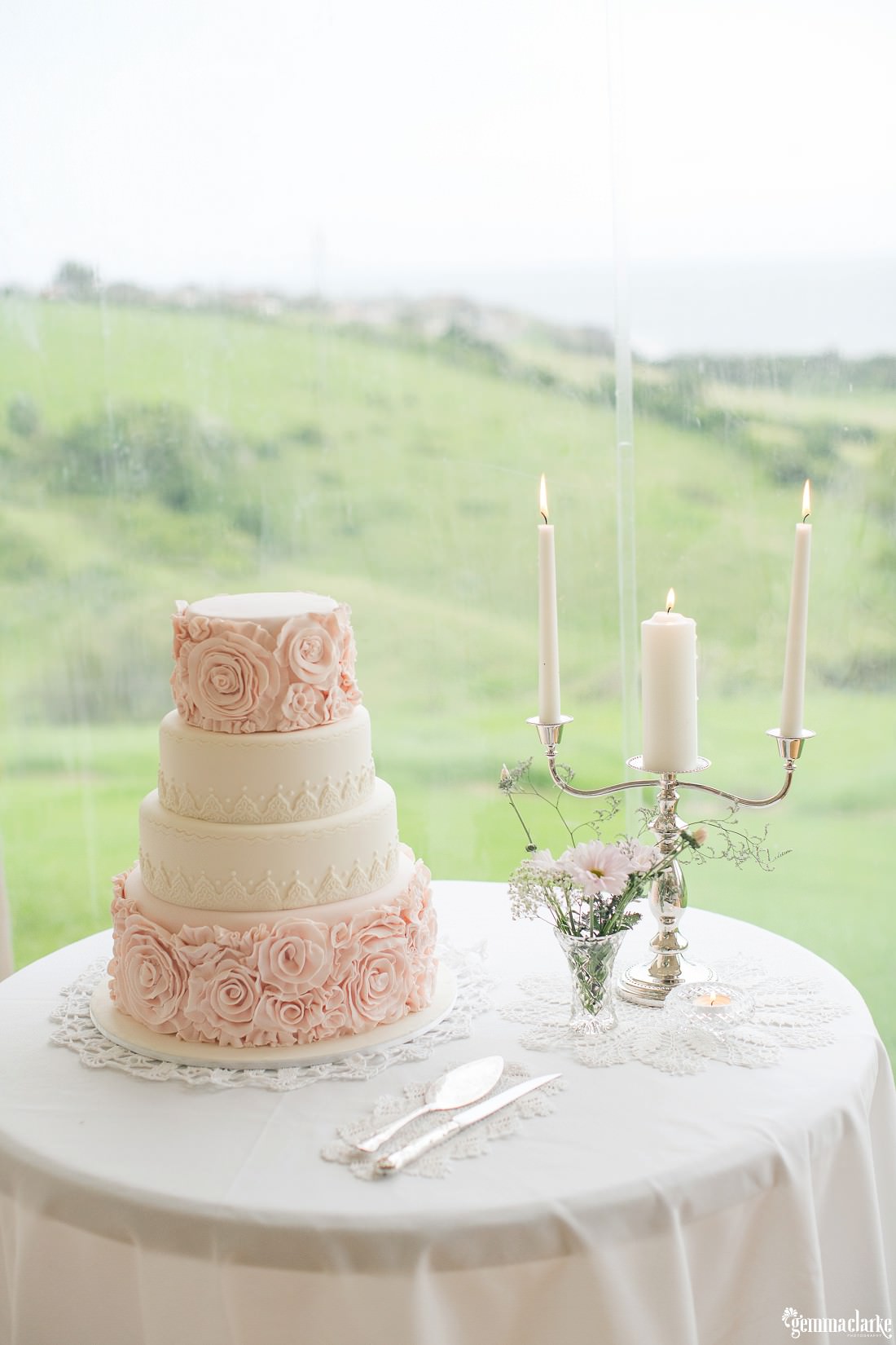 Pink and ivory four-tier wedding cake with rose embossed icing - Bush Bank Wedding
