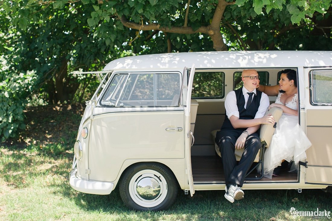 A bride and groom in the back of a Volkswagen Kombi bus – St Michael's Golf Club Wedding