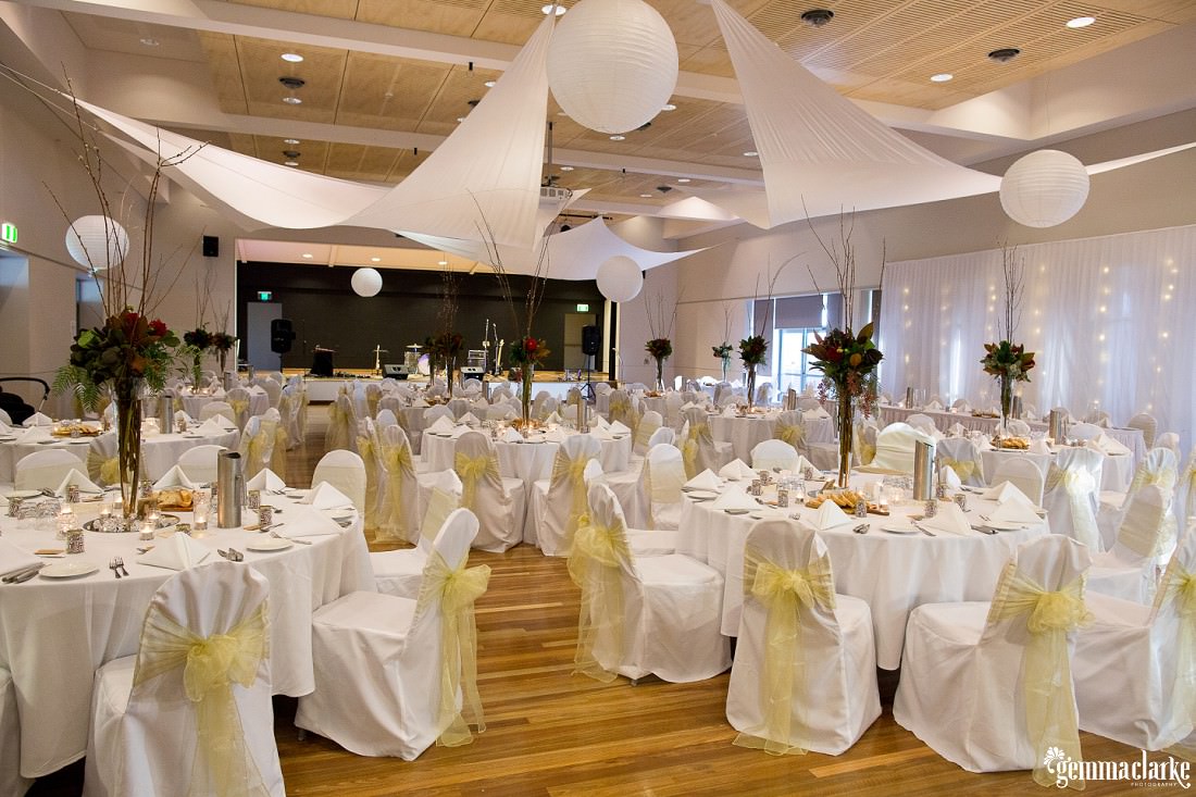 A wedding reception setup with lots of white details - Kiama Wedding
