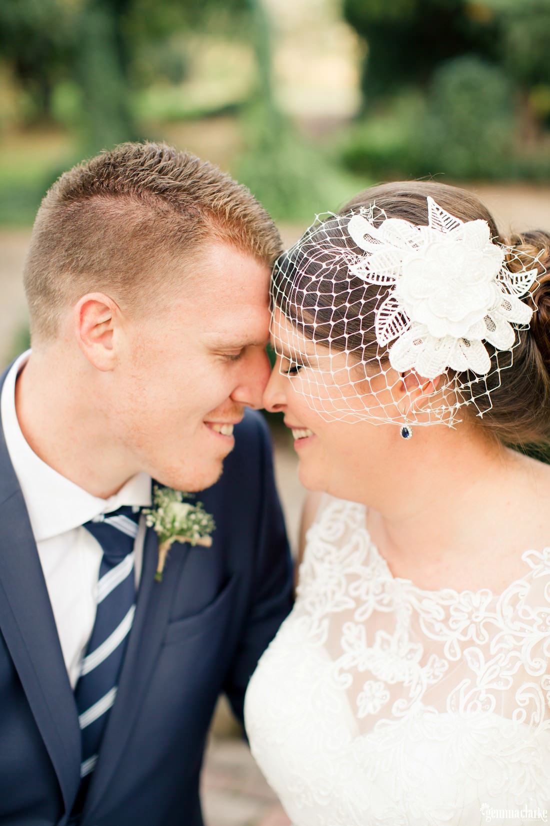 An intimate moment between a bride and groom with their foreheads and noses pressed together - Camden Wedding
