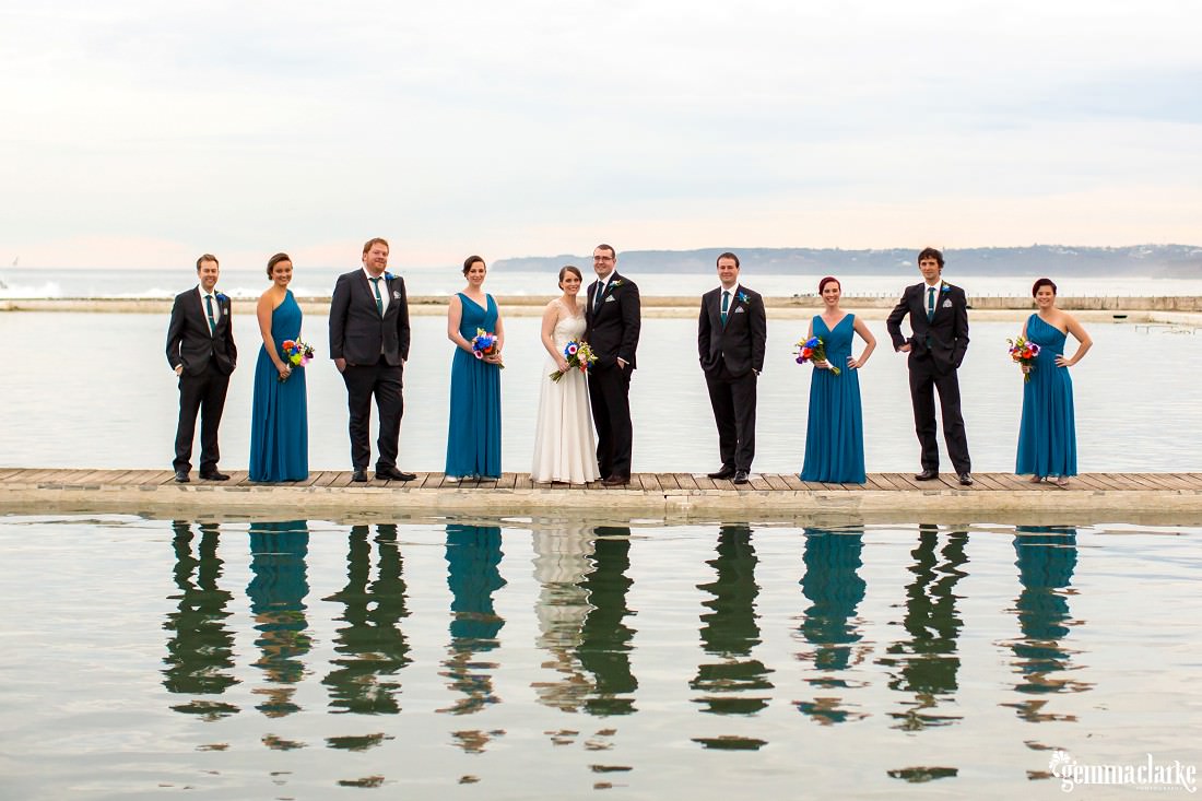 Relaxed bridal party reflected in the waters of Newcastle Baths - The Newcastle Club