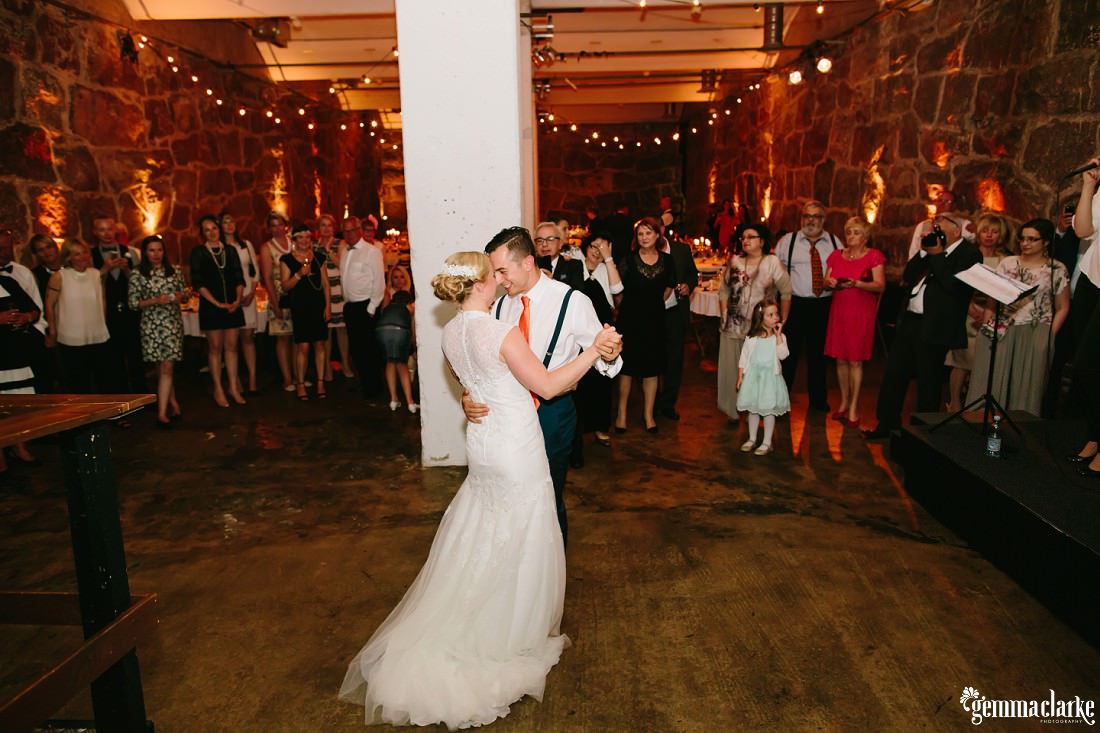 A bride and groom sharing their first dance at their wedding reception