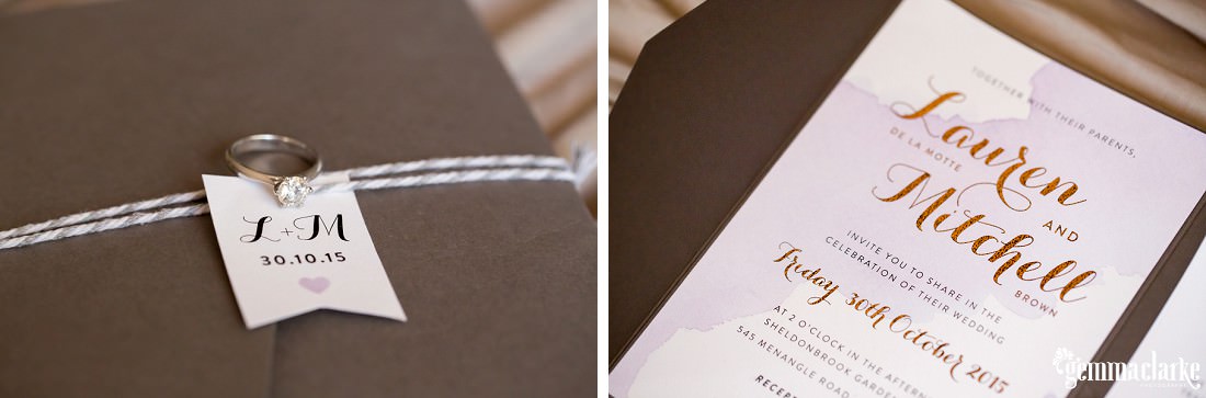 A diamond engagement ring on a paper tag and a wedding invitation