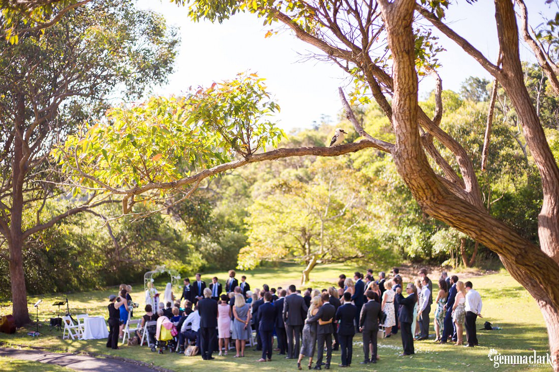 An overall shot of an outdoor wedding ceremony