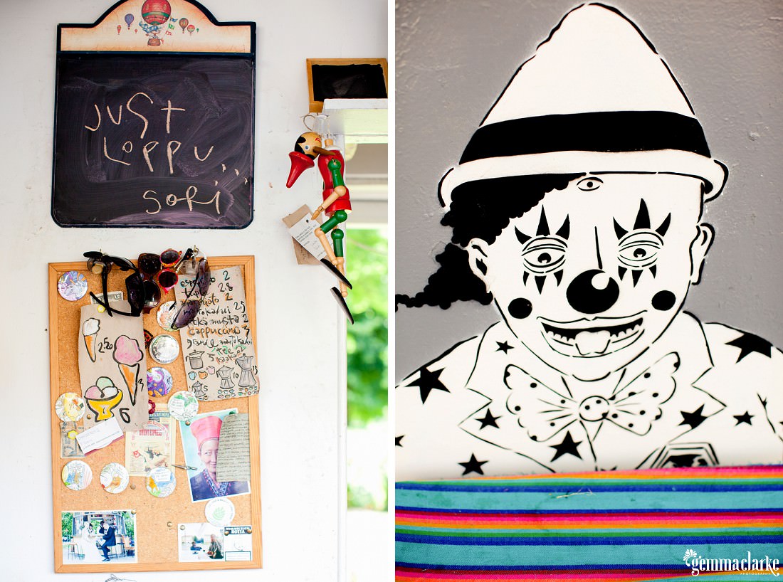 Clown artwork and a noticeboard in a cafe