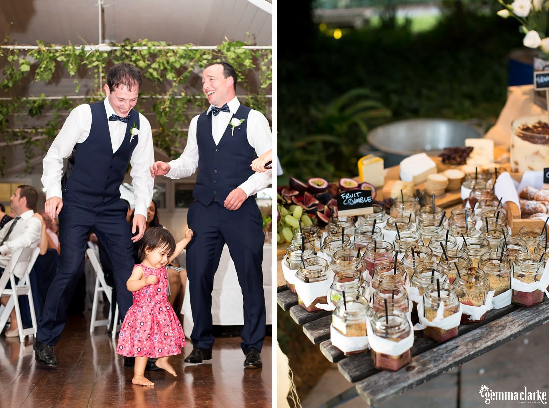 Groomsmen and a toddler on the dancefloor and some desserts on a table
