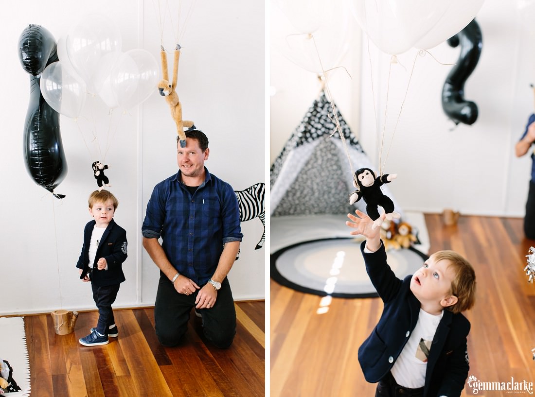 Very funny photo on the left of Henry and his dad with the toy monkeys which are attached to helium balloons appear to be standing on their heads!