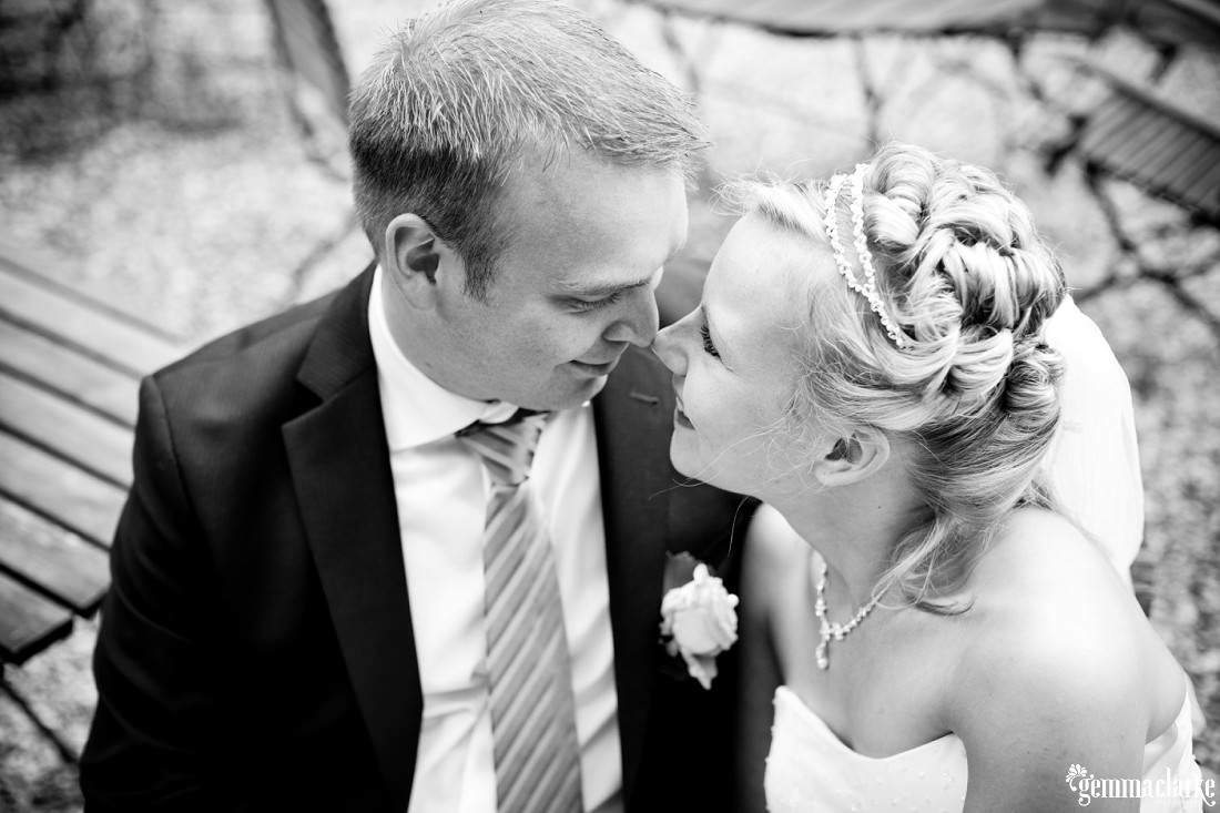 A bride and groom rubbing noses - German Country Wedding