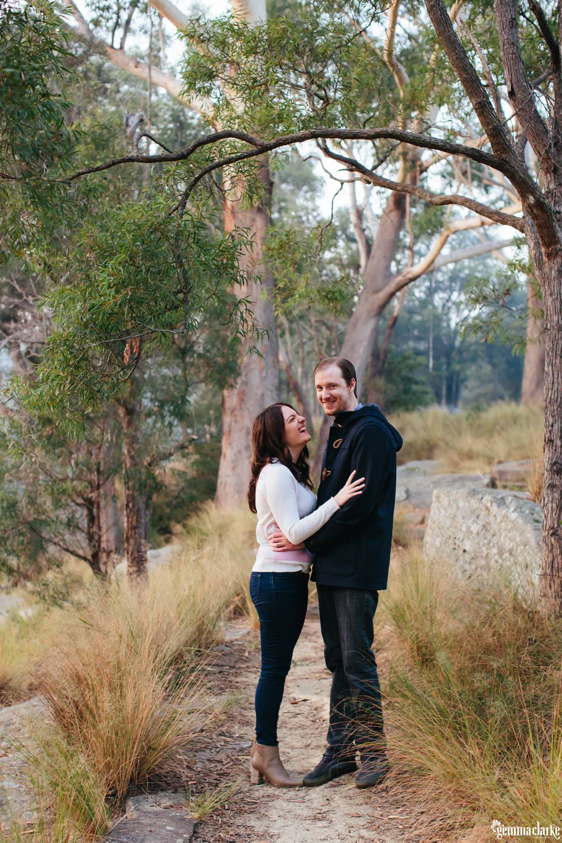 Full length photo with an overhanging tree as Shona looks at Rich and laughs - Lake Parramatta