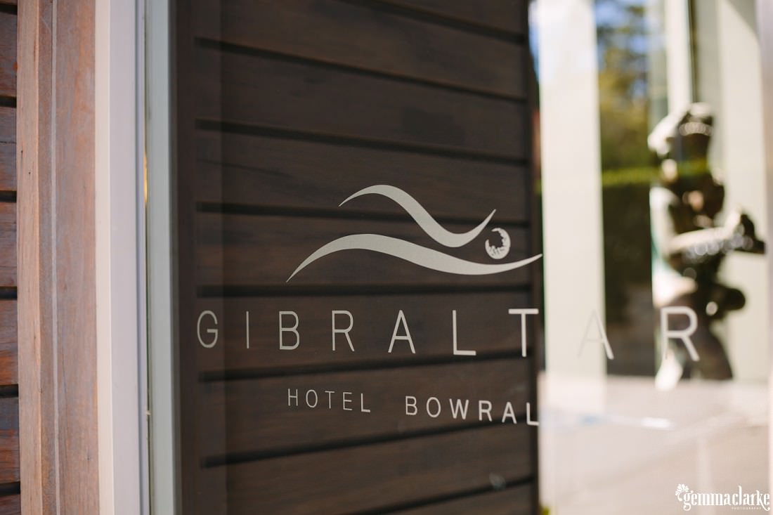 Gibraltar Hotel signage on a glass door