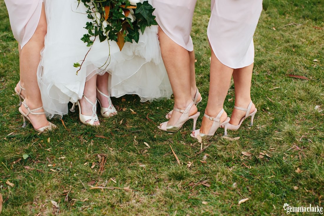 A close up bride and her bridesmaids' shoes