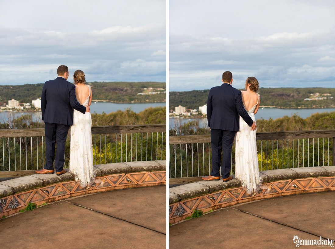 A cheeky groom grabs his new wife's bum as they stand at a lookout