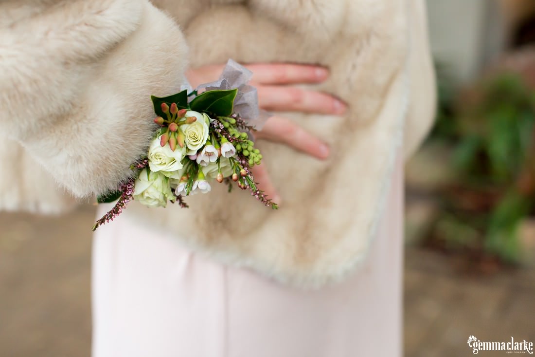 A close up of a bridesmaid's corsage