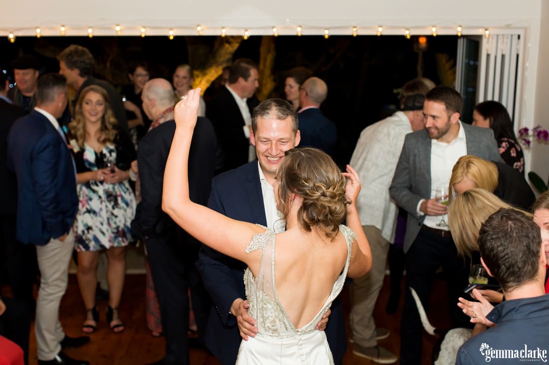 A bride and groom dancing together