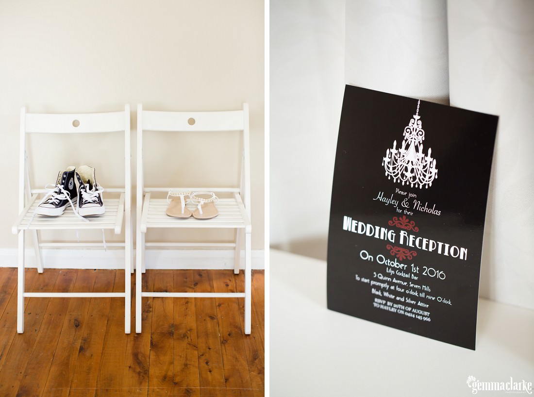 Two pairs of shoes on two white wooden chairs, and an invitation to a wedding reception