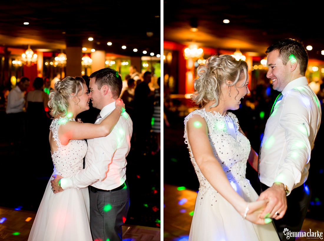 A bride and groom under coloured lights on the dance floor