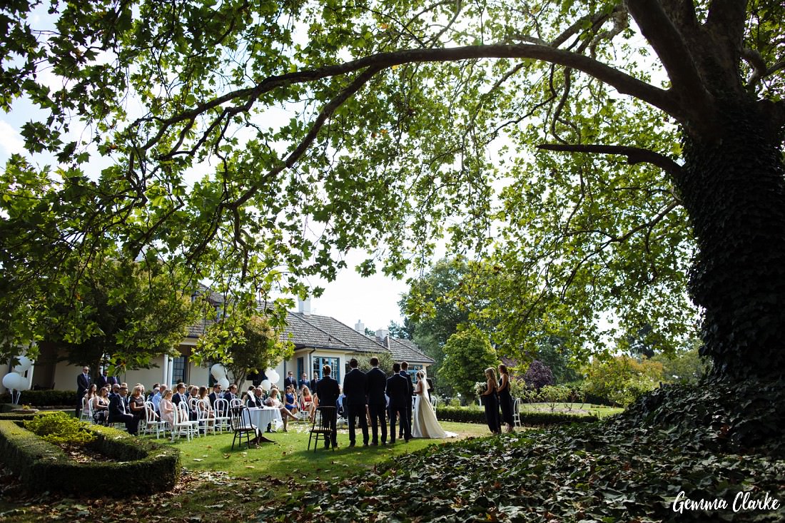 Ceremony with large overhanging tree with loads of green leaves at this Peppers Manor House Wedding