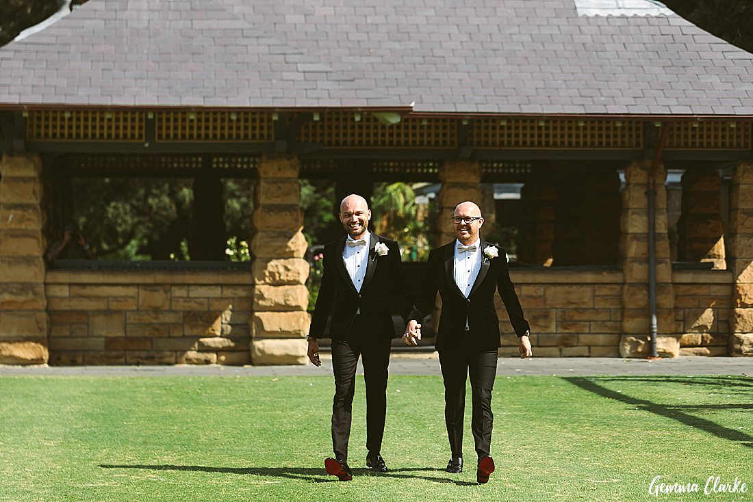 And here come the grooms hand in hand down the aisle and so excited see their friends and family at their Sydney Gay Wedding