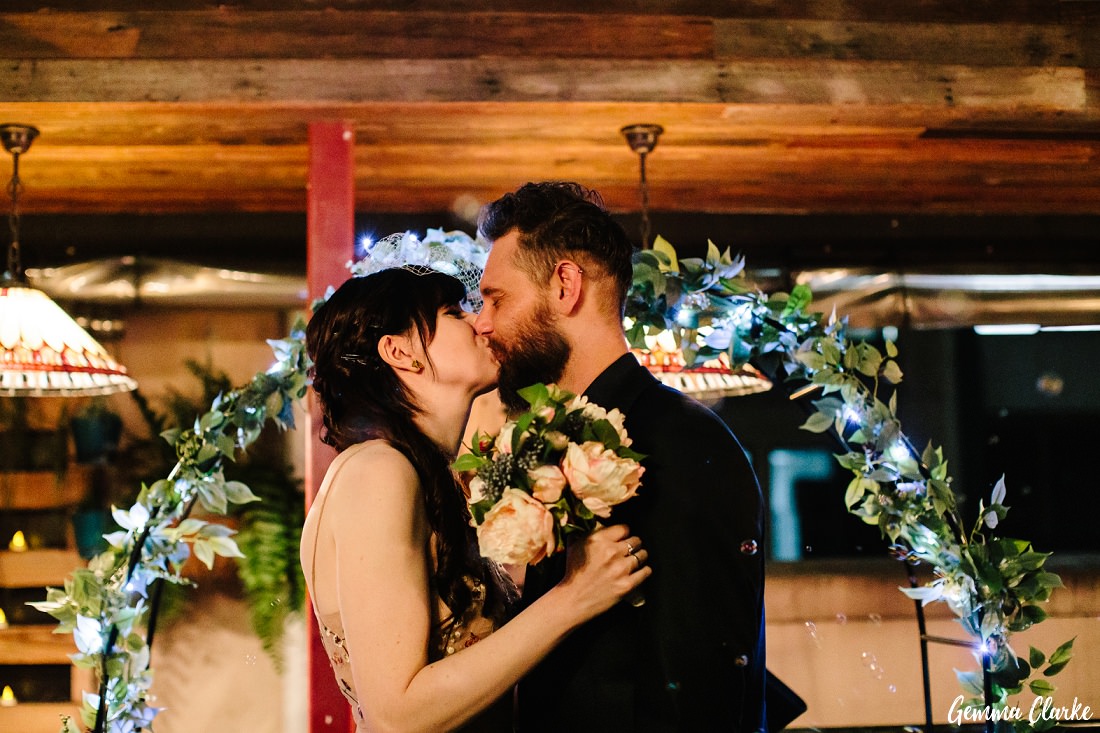 The kiss during the ceremony at this rooftop bar wedding
