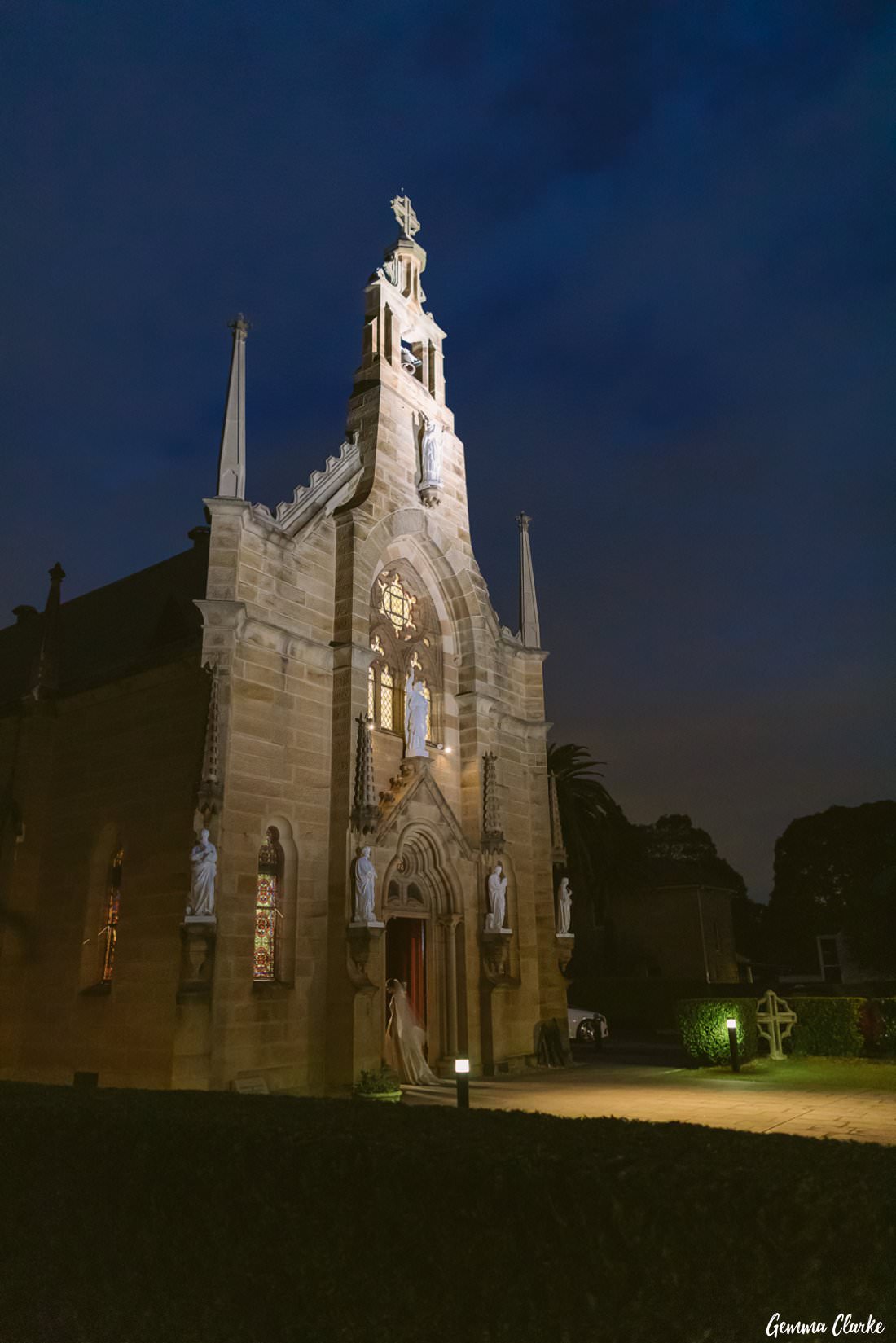 Stunning night photo of the bride walking back into the Holy Name of Mary church at this Hunters Hill Wedding