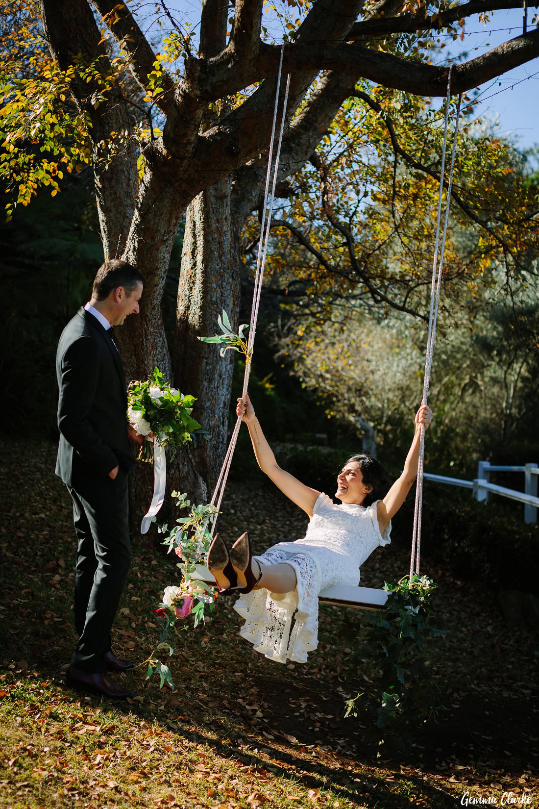 Anna Maria has lots of fun on the swing at her Loxley on Bellbird Hill Wedding with her groom looking on