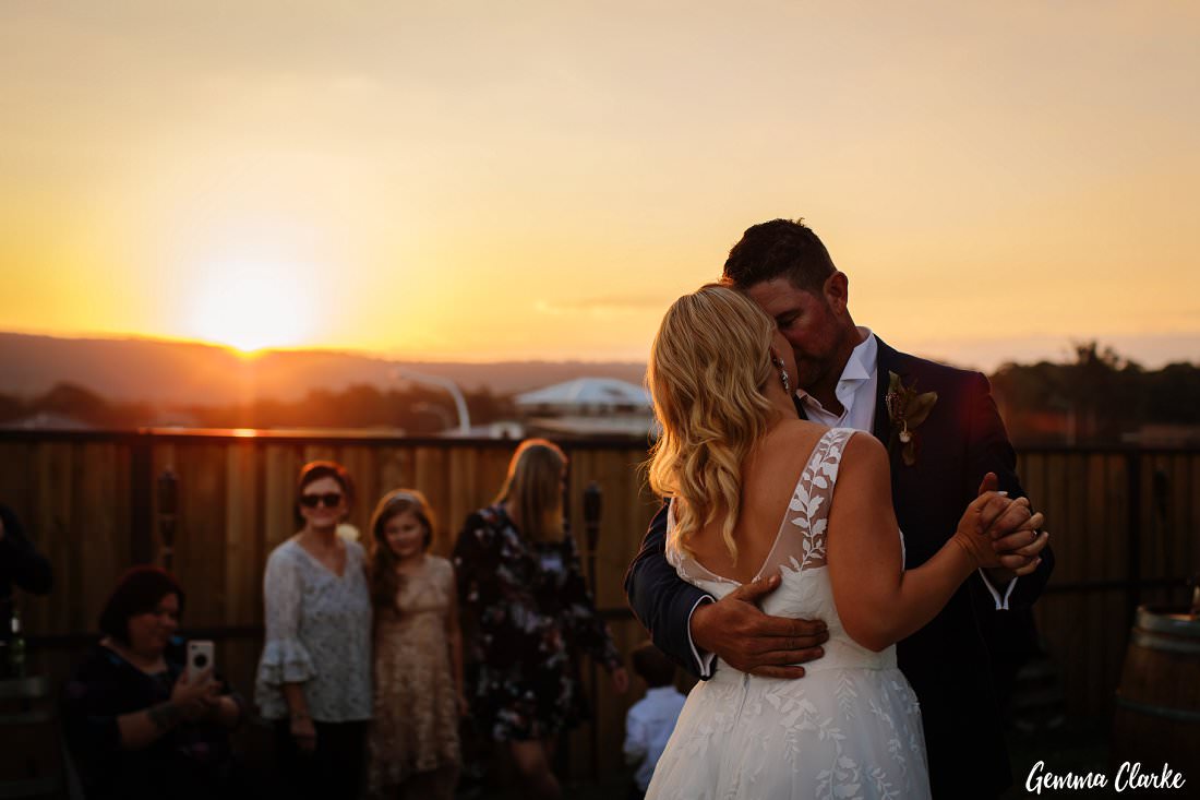 the first dance as the sun goes down on the blue mountains at this western sydney backyard wedding